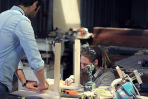 Jesse and Abde working on a prototype of Abde's chair design